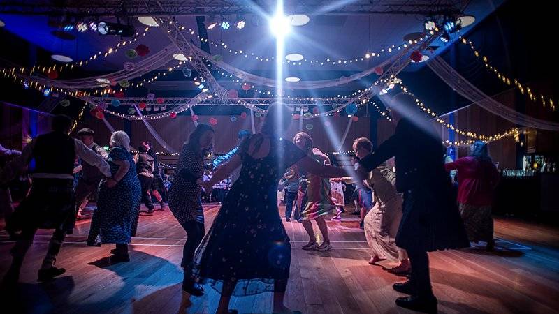 Ceilidh dancing at a large community event